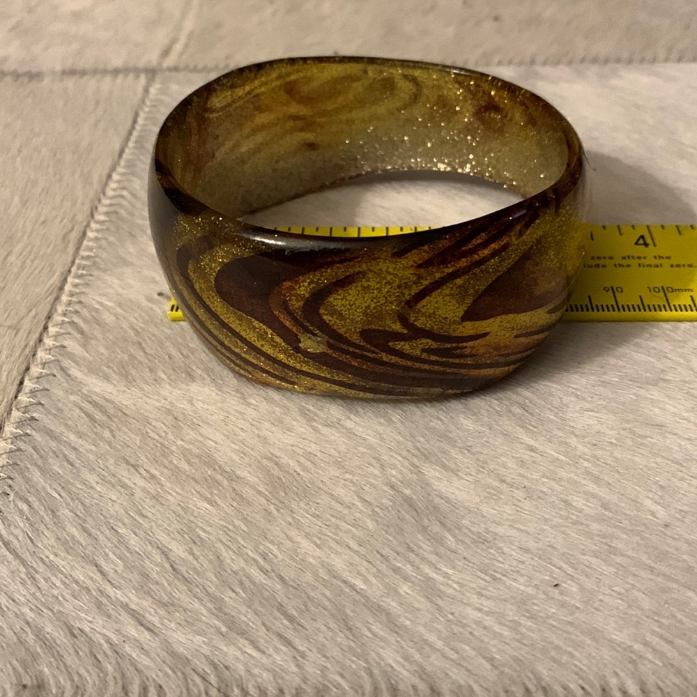 Multi colored (brown, orange, gold)  plastic/resin bracelet